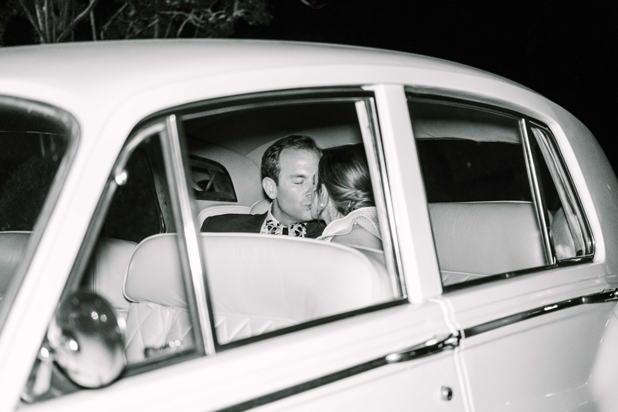 Bride and Groom in getaway car after Charleston Wedding